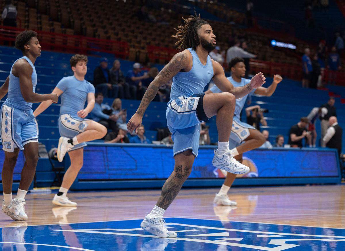 North Carolina guard R.J. Davis (4) warms up for the Tar Heels’ game against Kansas on Friday, November 8, 2024 at Allen Fieldhouse in Lawrence, Kansas.