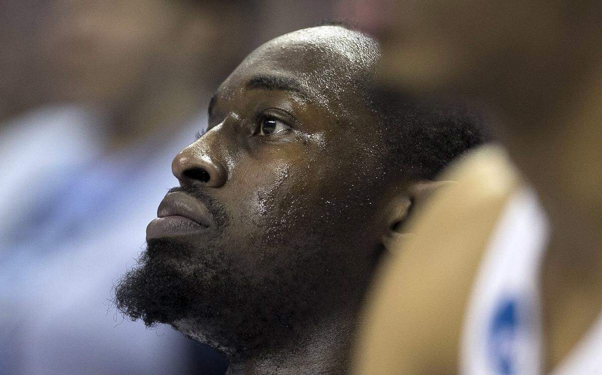 North Carolina's Theo Pinson (1) takes a seat on the bench after coming out of the game with less than a minute to play against Texas A&M during the second round of the NCAA Tournament on Sunday, March 18, 2018 at the Spectrum Center in Charlotte, N.C.