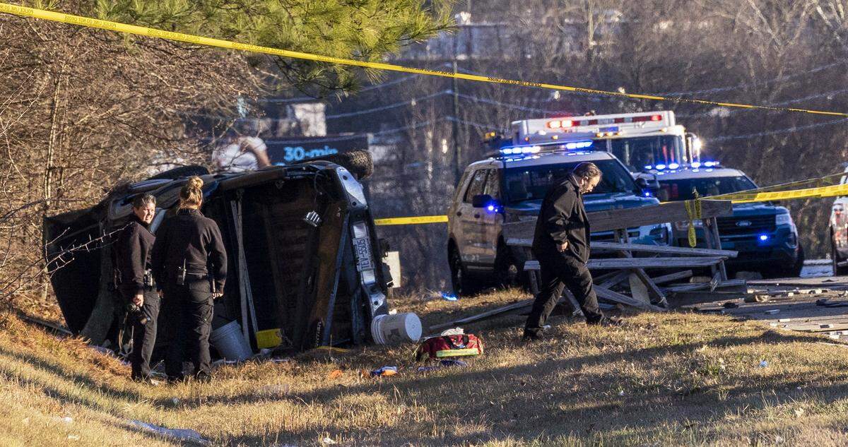 Raleigh police officers and firefighters work the scene of a crash on Interstate 440 Between New Bern Avenue and Brentwood Road that ìconcerns an officer-involved shooting,î the Raleigh Police Department said Tuesday, Jan. 11, 2022.