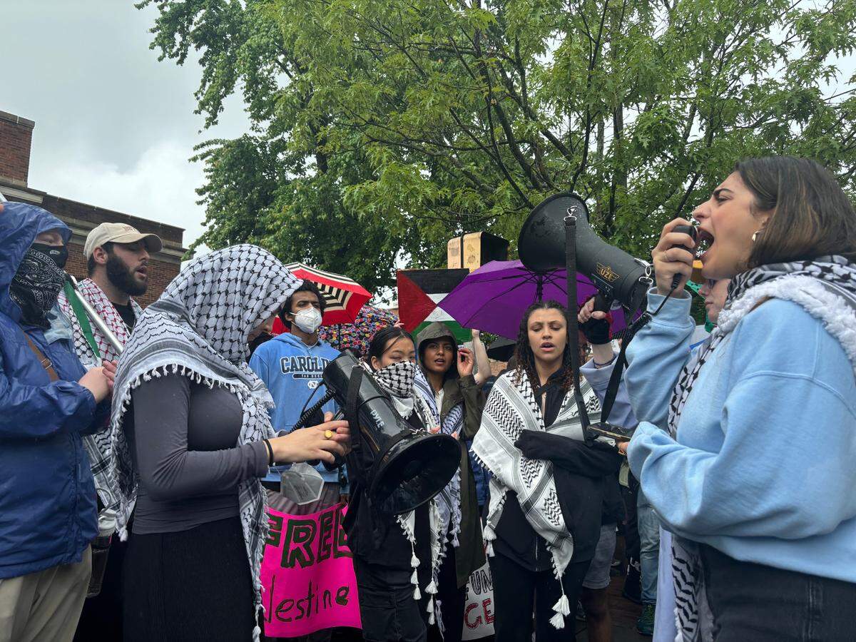 Protestors lead chants on Franklin Street in Chapel Hill on May 5, 2024 during a rally in support of Palestine.