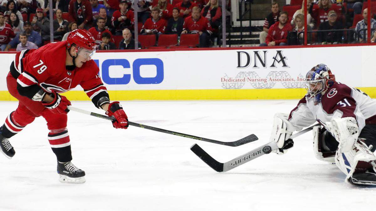 Carolina Hurricanes’ Micheal Ferland (79) has his shot stopped by Colorado Avalanche’s Philipp Grubauer (31), of Germany, during the second period of an NHL hockey game in Raleigh, N.C., Saturday, Oct. 20, 2018.
