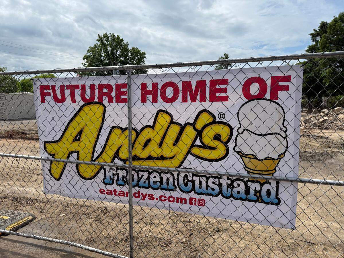 A sign announcing a new Andy’s Frozen Custard is posted on a fence around a construction site in Raleigh.