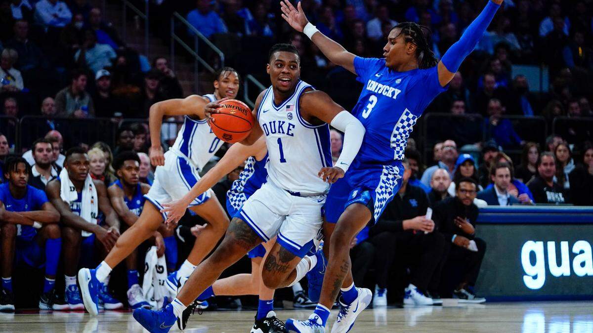 Duke’s Trevor Keels (1) drives past Kentucky’s TyTy Washington (3) during the first half of an NCAA college basketball game Tuesday, Nov. 9, 2021, in New York.