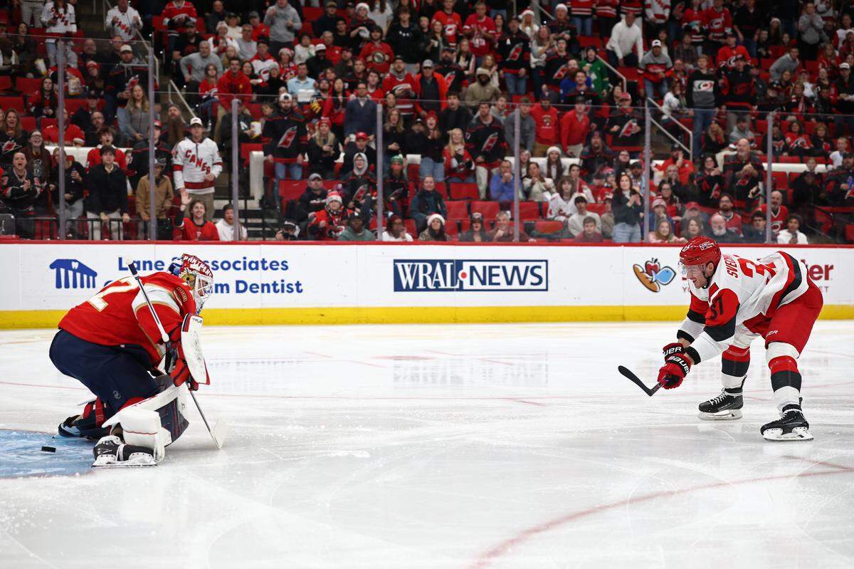 Carolina Hurricanes forward Andrei Svechnikov shoots to score a goal against Sergei Bobrovsky of the Florida Panthers during the second period at Lenovo Center on Dec. 23, 2025 in Raleigh, North Carolina.