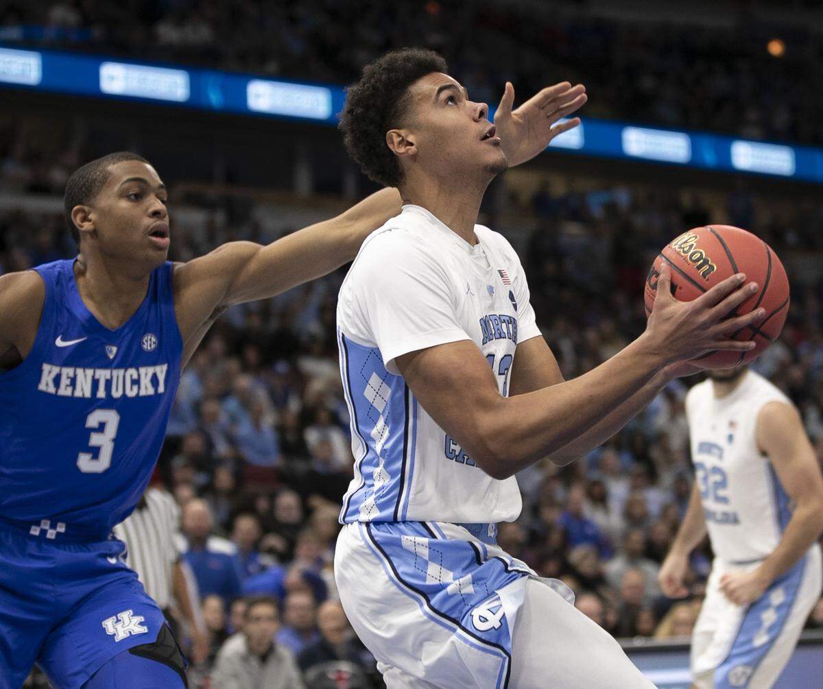 North Carolina’s Cameron Johnson (13) drives to the basket against Kentucky’s Keldon Johnson (3) during the first half of the 2018 CBS Sports Classic on Saturday, December 22, 2018 at United Center in Chicago, Illinois.