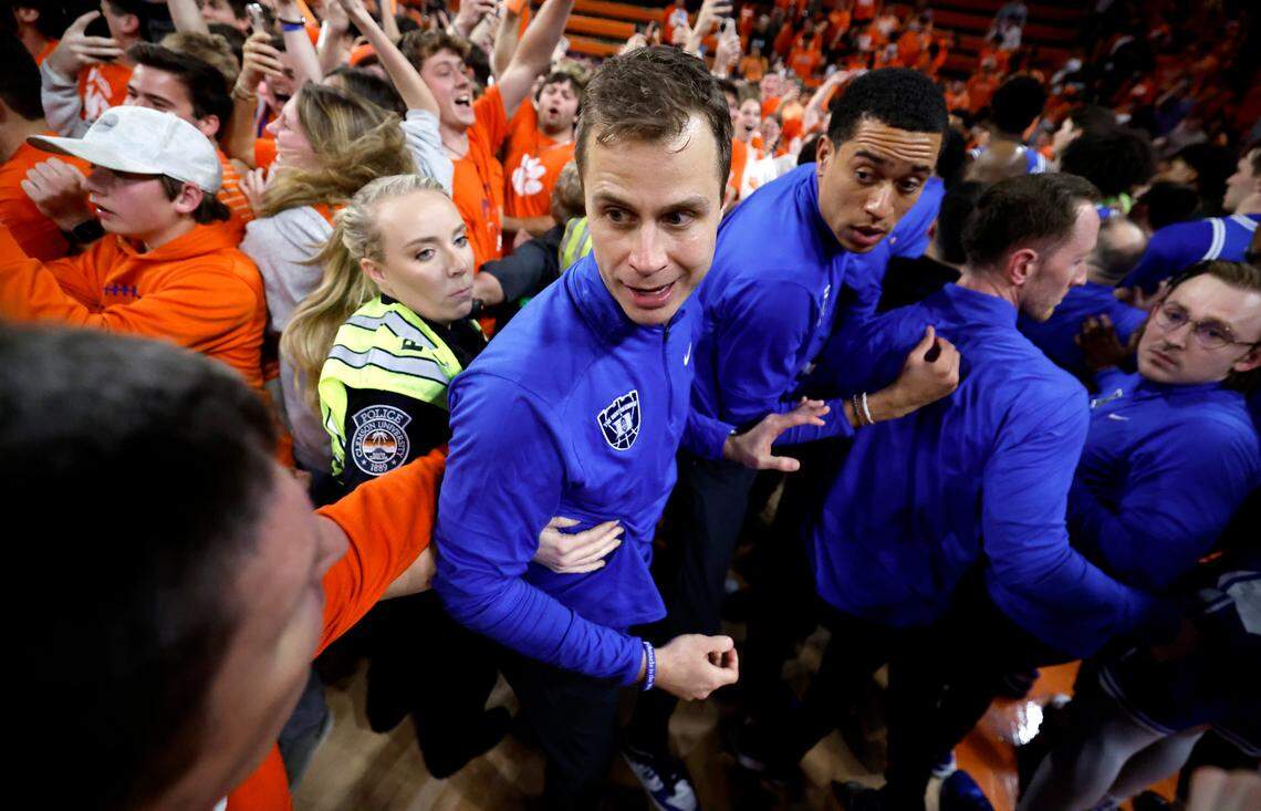 Clemson head coach Brad Brownell helps direct Duke head coach Jon Scheyer the way off the court after Clemson’s 77-71 victory over Duke at Littlejohn Coliseum in Clemson, S.C., Saturday, Feb. 8, 2025.