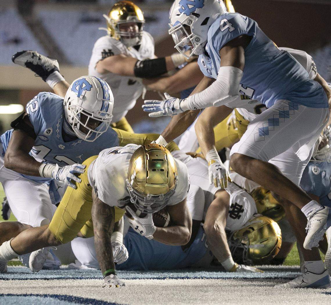 Notre Dame’s Kyren Williams (23) scores on a one-yard carry to secure Notre Dame’s 31-17 victory over North Carolina on Friday, November 27, 2020 at Kenan Stadium in Chapel Hill, N.C.