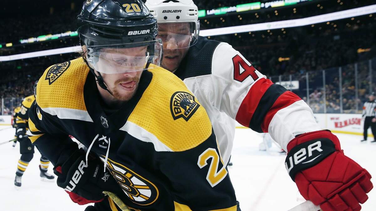 New Jersey Devils’ Sami Vatanen (45) battles Boston Bruins’ Joakim Nordstrom (20) for the puck during the second period of an NHL hockey game in Boston, Saturday, March 2, 2019. (AP Photo/Michael Dwyer)