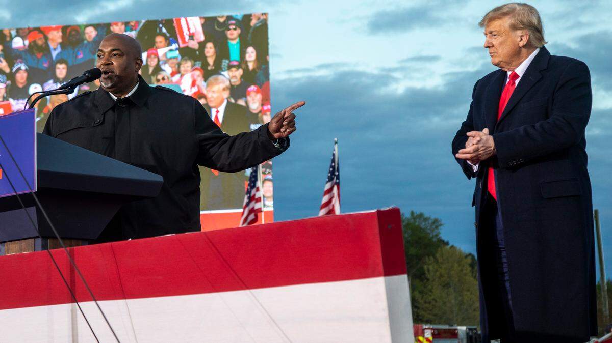 North Carolina Lt. Gov. Mark Robinson and former President Donald Trump share the stage during a rally in Selma, N.C. on April 9, 2022.