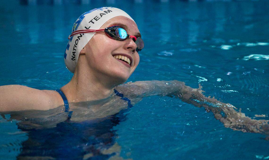 Olympic qualifier Claire Curzan, 17, smiles at her coach while practicing for the 2020 Tokyo Olympics at the Triangle Aquatic Center in Cary, N.C. on June 24, 2021.