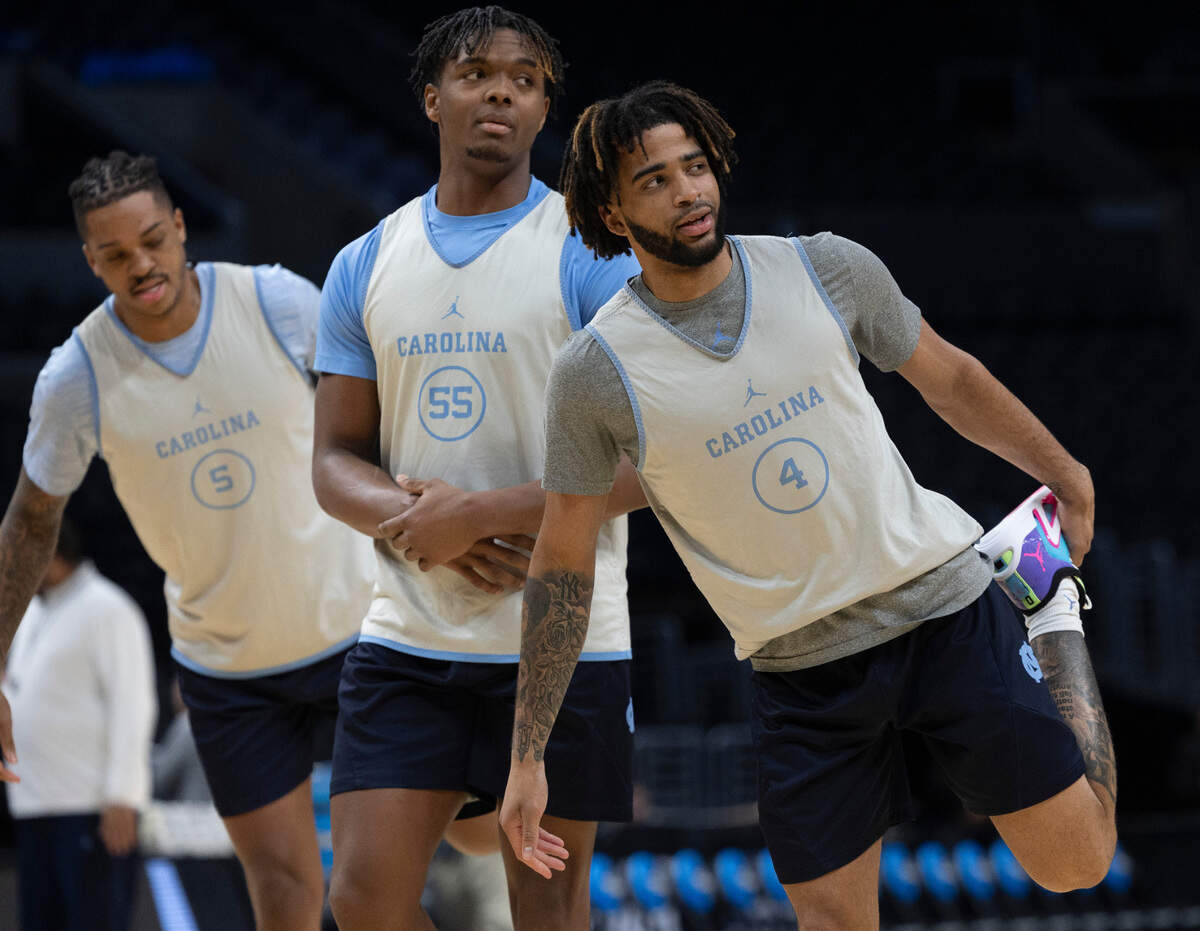 North Carolina’s Armando Bacot, Harrison Ingram and R.J. Davis stretch during the Tar Heels practice on Wednesday, March 27, 2024 at Crypto.com Arena in Los Angeles, CA.