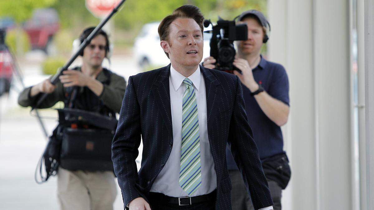 With a video crew behind him, Democratic candidate for U.S House Clay Aiken arrives to vote at Mills Park Elementary School in Cary, NC on May 6, 2014.