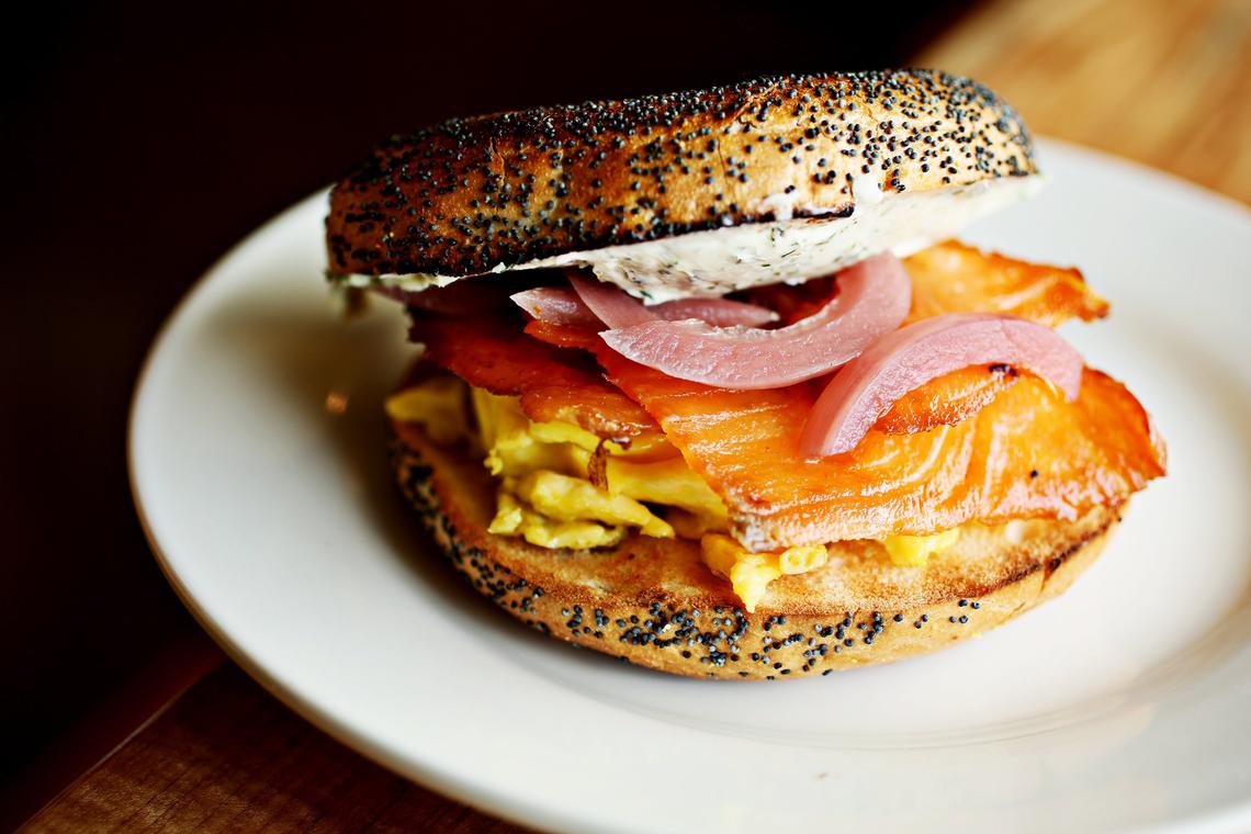 Bagels are just one option for the breakfast sandwich lineup at the house-cured meat specialist, Cure Delicatessen and Cafe, in Durham. The Number One is a smoked salmon "bacon", baked egg, pickled onion and herb cream cheese served on a poppyseed bagel.