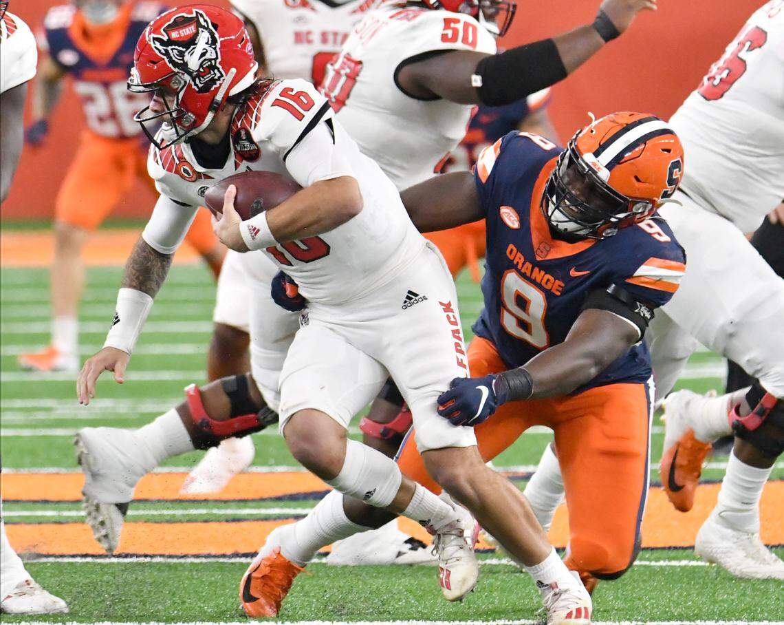 Syracuse Orange defensive lineman Kingsley Jonathan (9) sacks North Carolina State Wolfpack quarterback Bailey Hockman (16) in the second quarter at the Carrier Dome.