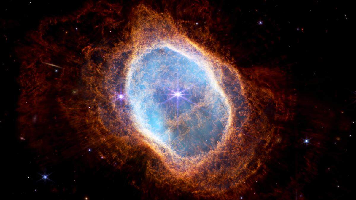 The bright star at the center of NGC 3132, while prominent when viewed by NASA’s Webb Telescope in near-infrared light, plays a supporting role in sculpting the surrounding nebula. A second star, barely visible at lower left along one of the bright star’s diffraction spikes, is the nebula’s source. It has ejected at least eight layers of gas and dust over thousands of years.