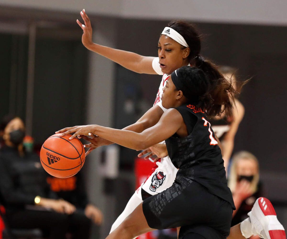 N.C. State’s Jada Boyd (5) tries to steal the ball from Virginia Tech’s Aisha Sheppard (2) during the second half of N.C. State’s 89-87 victory over Virginia Tech at Reynolds Coliseum in Raleigh, N.C., Sunday, January 24, 2021.