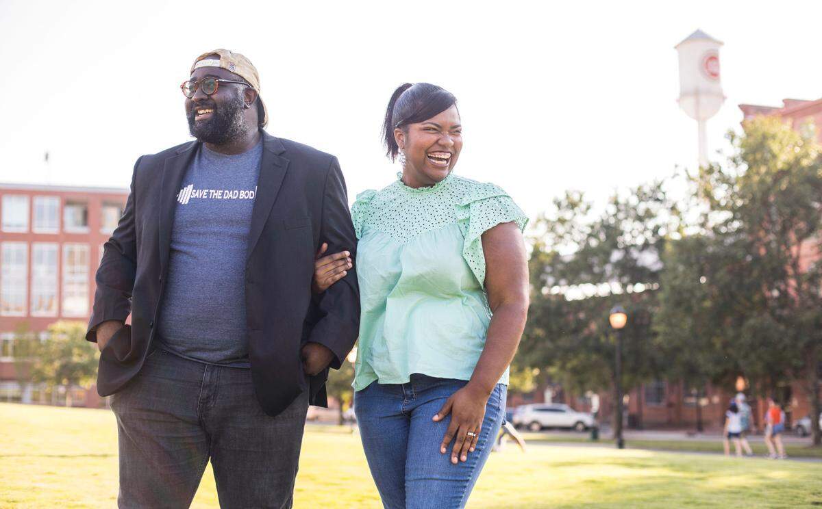 Michael and Bria Washington pose for a portrait in Durham, N.C. on Aug. 5, 2021. At just 26 years old, Michael was diagnosed with kidney cancer. His wife Bria, then-fiancé, had strongly encouraged him to go to the doctor where he found out the news. Michael has since recovered, and made a documentary-style film called “Save the Dad Bod” through his company, Argyle Rebel Films, about his experience and the state of men’s health.