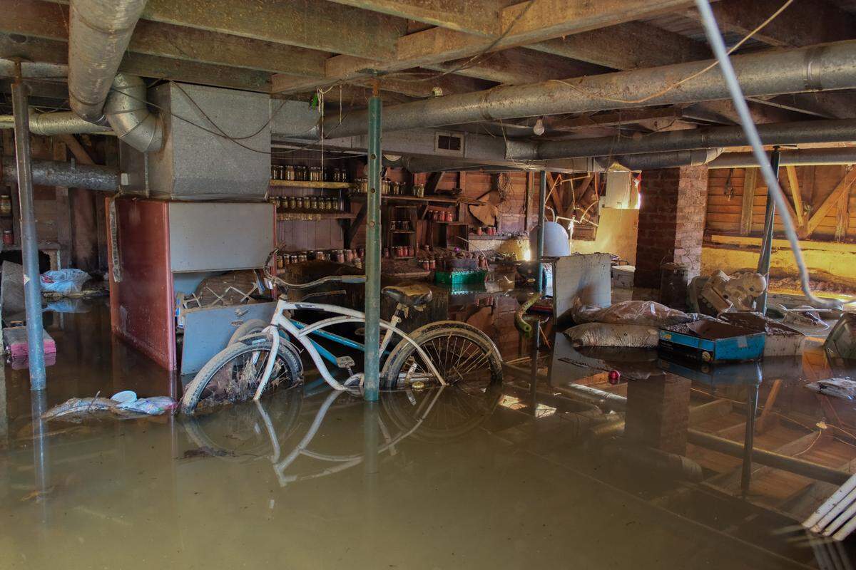 The basement of a house in Swannanoa, N.C., is full of murky water while volunteers from Samaritan’s Purse help to clear out the property on Oct. 26, 2024.