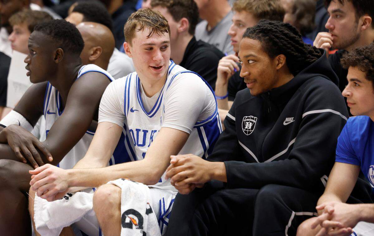 Duke’s Cooper Flagg (2) talks with Maliq Brown during the second half of Duke’s 89-54 victory over Miami at Cameron Indoor Stadium in Durham, N.C., Tuesday, Jan. 14, 2025.