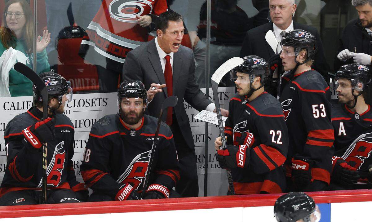 Carolina coach Rod Brind'Amour talks to the team before the start of overtime in the Hurricanes’ 3-2 victory over the Canadiens in game two of the Eastern Conference Finals at the Lenovo Center in Raleigh, N.C., Saturday, May 23, 2026.