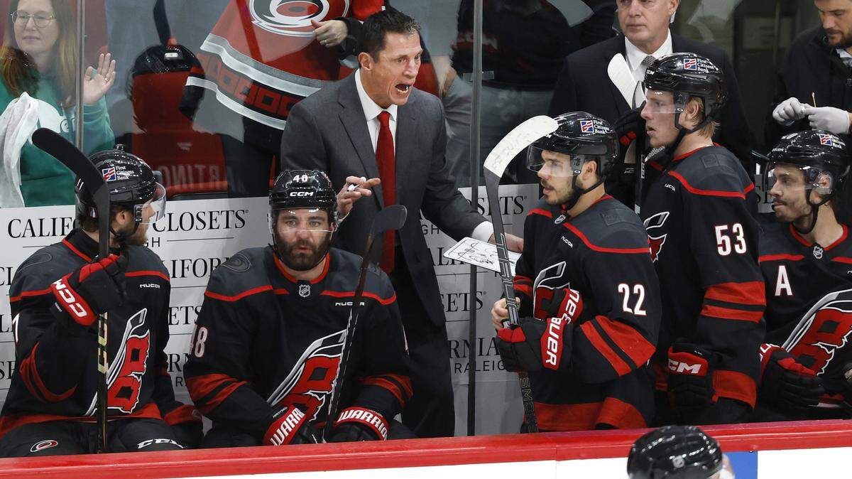 Carolina coach Rod Brind'Amour talks to the team before the start of overtime in the Hurricanes’ 3-2 victory over the Canadiens in game two of the Eastern Conference Finals at the Lenovo Center in Raleigh, N.C., Saturday, May 23, 2026.
