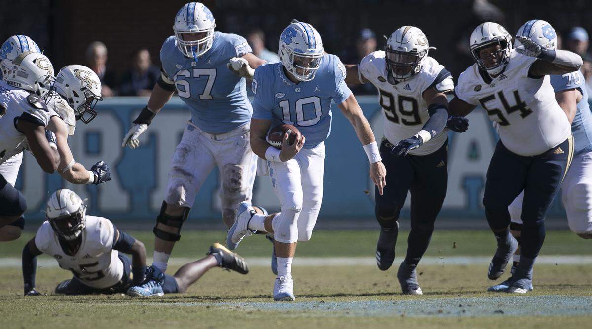 North Carolina quarterback Jace Ruder (10) picks up 13 yards the third quarter against Georgia Tech on Saturday, November 3, 2018 at Kenan Stadium in Chapel Hill, N.C.