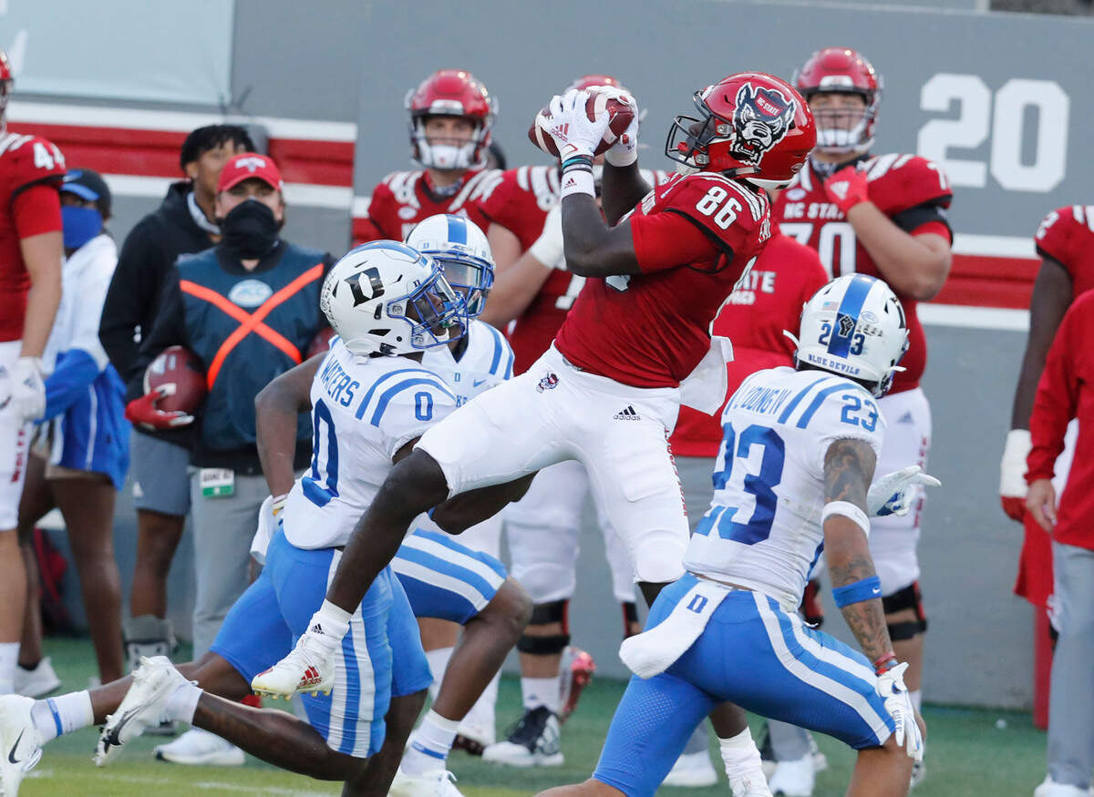 N.C. State wide receiver Emeka Emezie (86) pulls in the reception as Duke safety Marquis Waters (0) defends during the first half of N.C. State’s game against Duke at Carter-Finley Stadium in Raleigh, N.C., Saturday, Oct. 17, 2020.