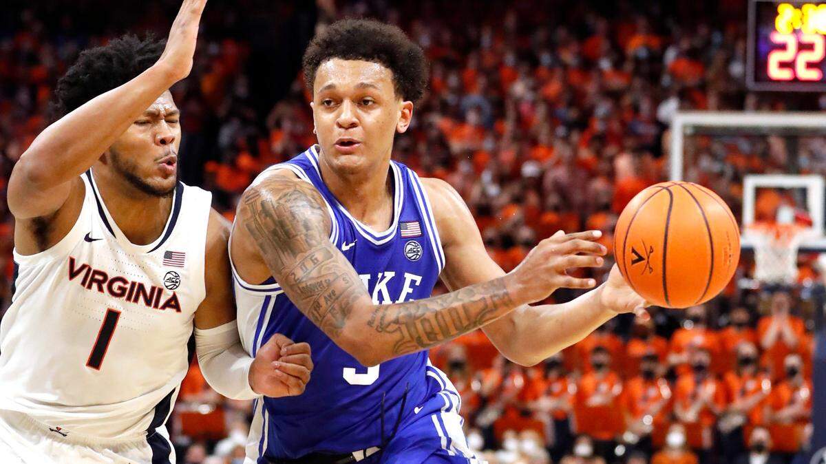 Duke’s Paolo Banchero (5) drives as Virginia’s Jayden Gardner (1) defends during the first half of Duke’s game against Virginia at John Paul Jones Arena in Charlottesville, VA, Wednesday, Feb. 23, 2022.