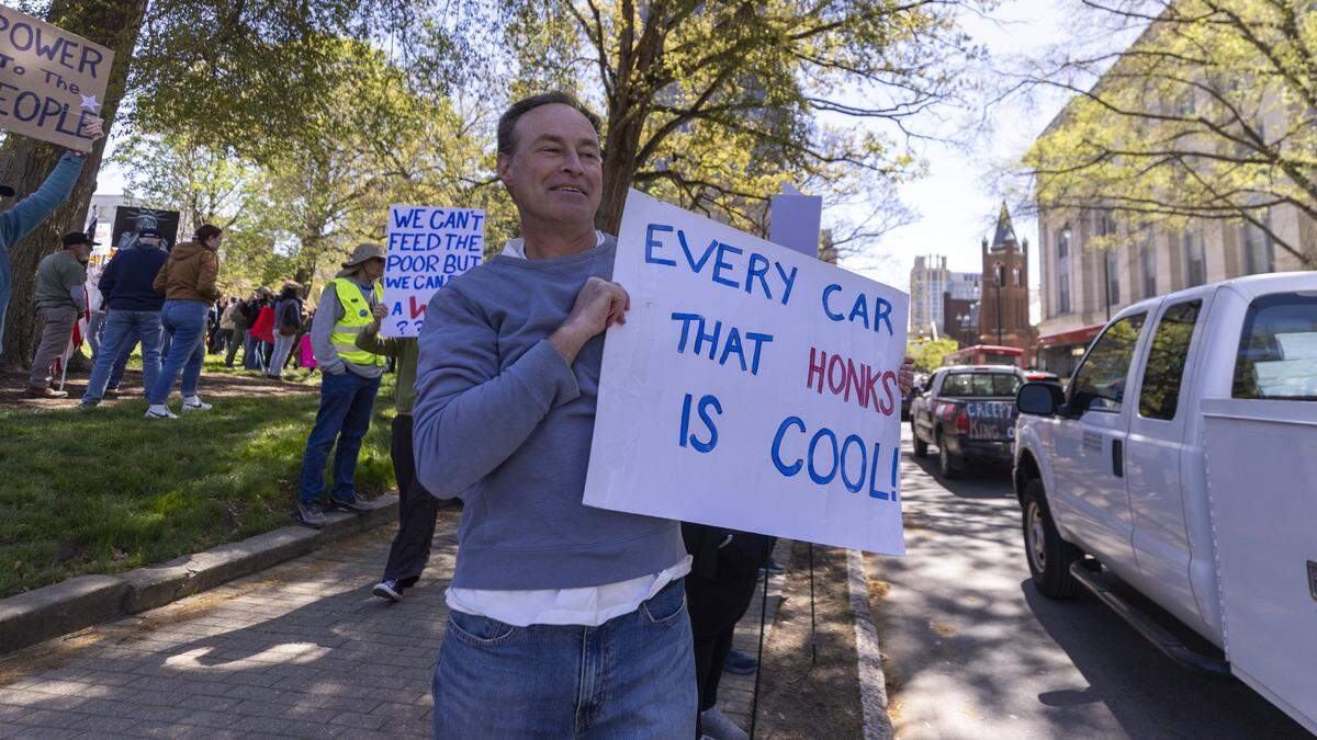 Hundreds of demonstrators gather outside the North Carolina State Capitol in Raleigh on Saturday, March 28, 2026, during a “No Kings” protest against President Donald Trump and his agenda. More than 70 cities and towns across North Carolina participated in nationwide protests Saturday.