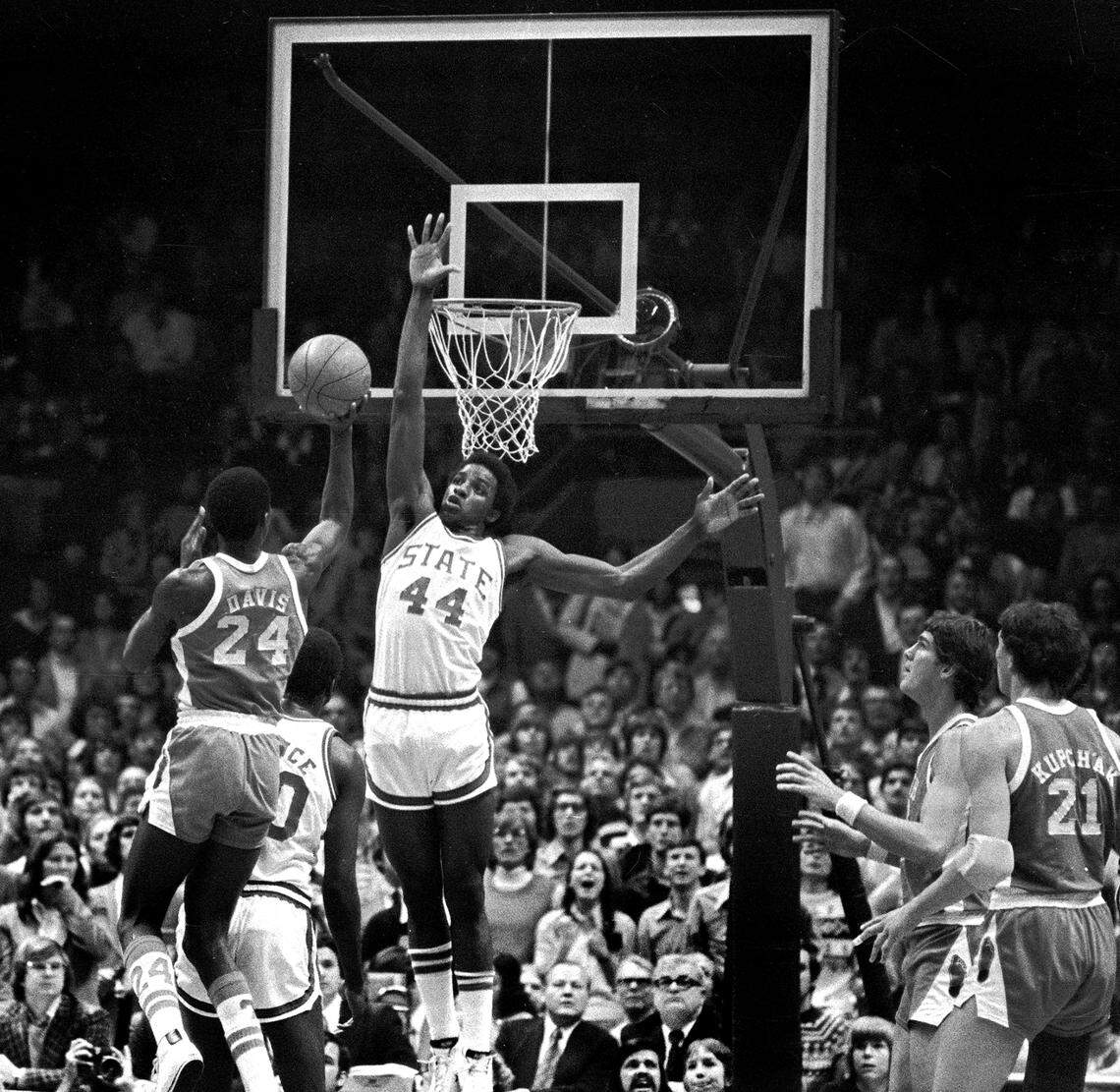 NC State’s David Thompson defends against UNC’s Walter Davis during a game between the Tar Heels and Wolfpack in the 1975 ACC Tournament.