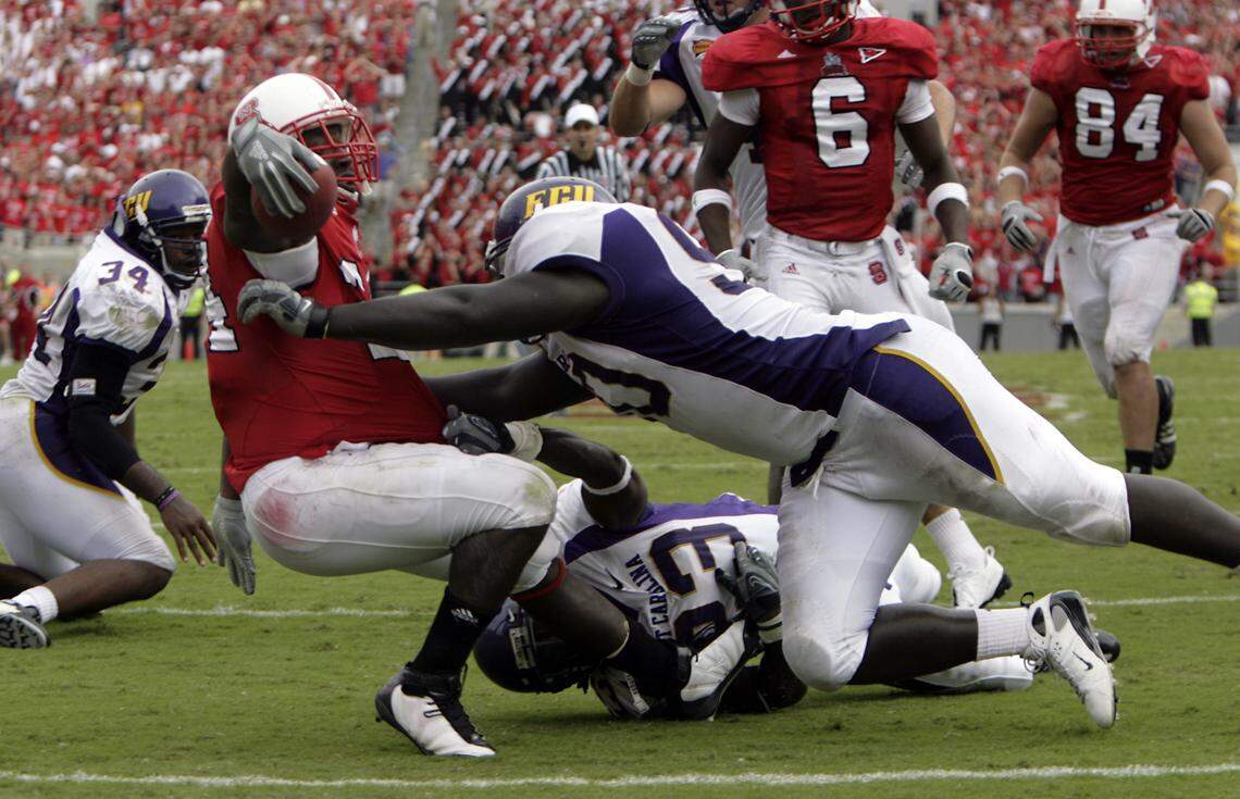 NC State’s Andre Brown (24) score the game winning touchdown in overtime to give the Wolfpack 30-24 overtime victory over East Carolina at Carter-Finley Stadium in 2008.