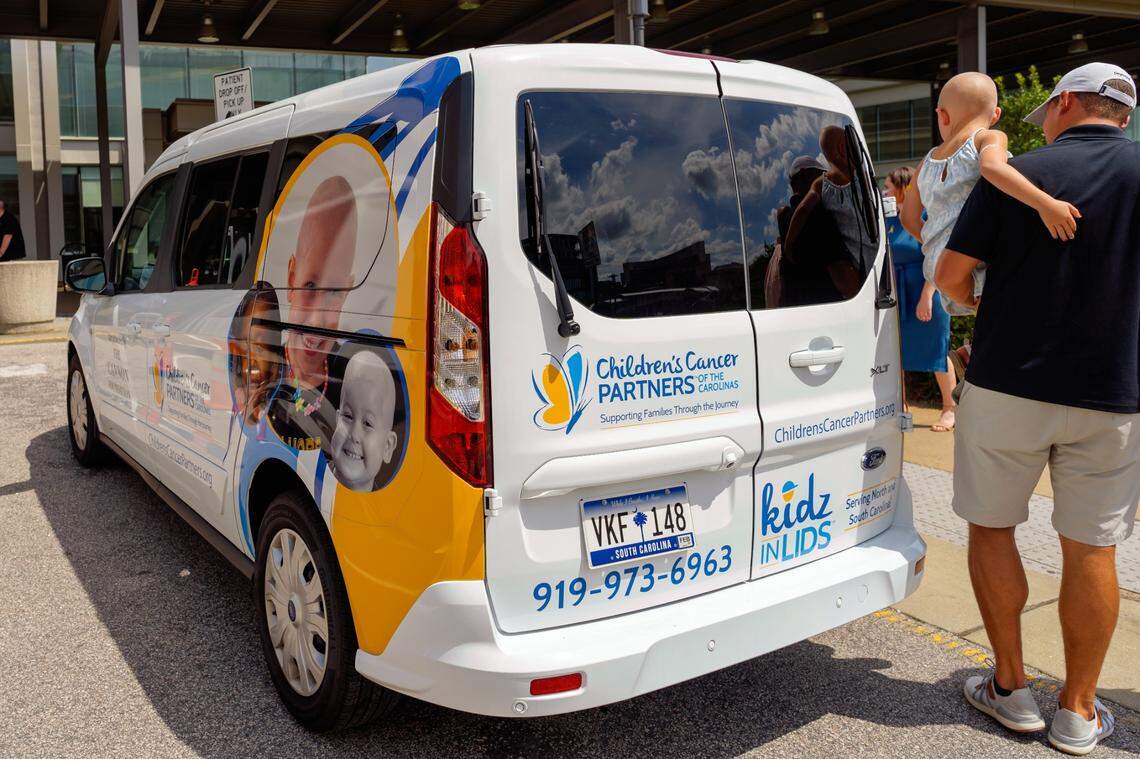 The new Family Assistance Van for Children’s Cancer Partners of the Carolinas was unveiled on Tuesday, July 12, in front of the North Carolina Cancer Hospital. The faces of three children who have received CCP support and funding were printed on both sides of the van.