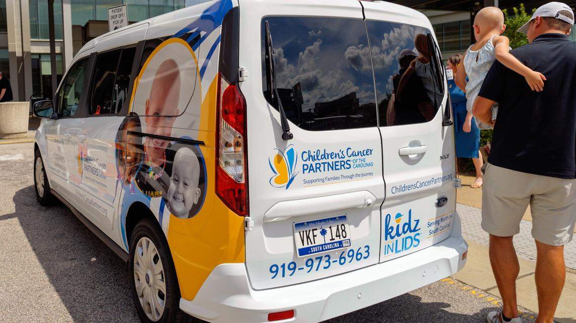 The new Family Assistance Van for Children’s Cancer Partners of the Carolinas was unveiled on Tuesday, July 12, in front of the North Carolina Cancer Hospital. The faces of three children who have received CCP support and funding were printed on both sides of the van.