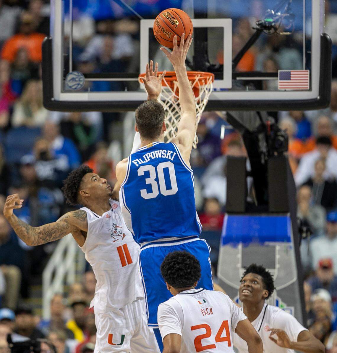 Duke’s Kyle Filipowski (30) put up a shot against Miami’s Jordan Miller (11) in the second half during in the semi-finals of the ACC Tournament on Friday, March 10, 2023 at the Greensboro Coliseum in Greensboro, N.C.