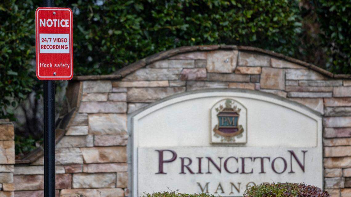 Signs give notice of the use of Flock Safety security cameras at entrances to the Princeton Manor neighborhood in Knightdale.