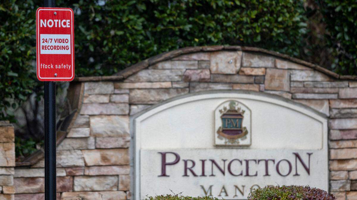 Signs give notice of the use of Flock Safety security cameras at entrances to the Princeton Manor neighborhood in Knightdale.