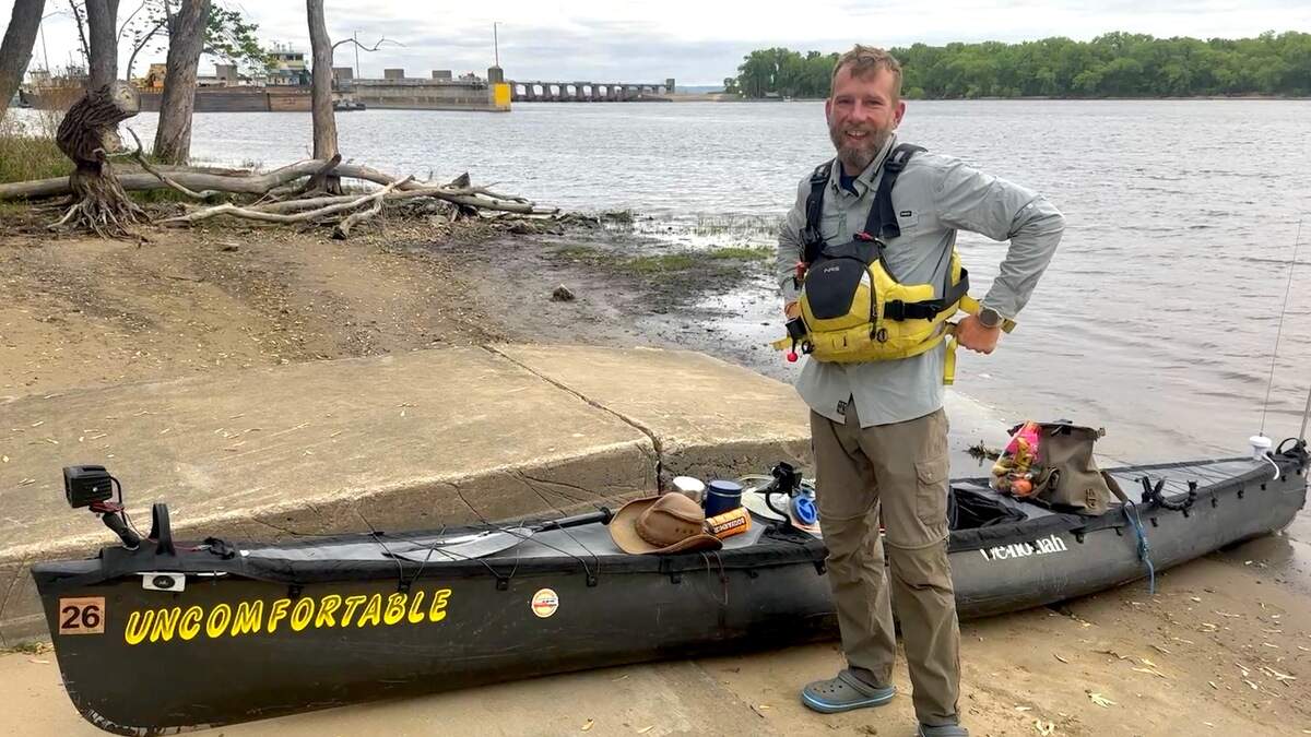 Ilia Smirnov with his kayak, Uncomfortable.
