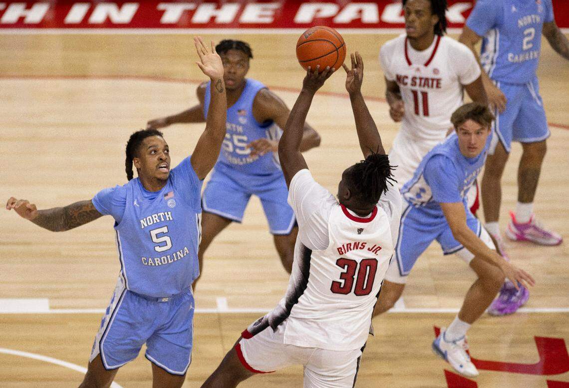 North Carolina’s Armando Bacot (5) defends N.C. State’s D.J. Burns Jr. (30) in the first half on Wednesday, January 10, 2024 at PNC Arena in Raleigh, N.C. The Tar Heels held burns to 11 point in their 67-54 victory.