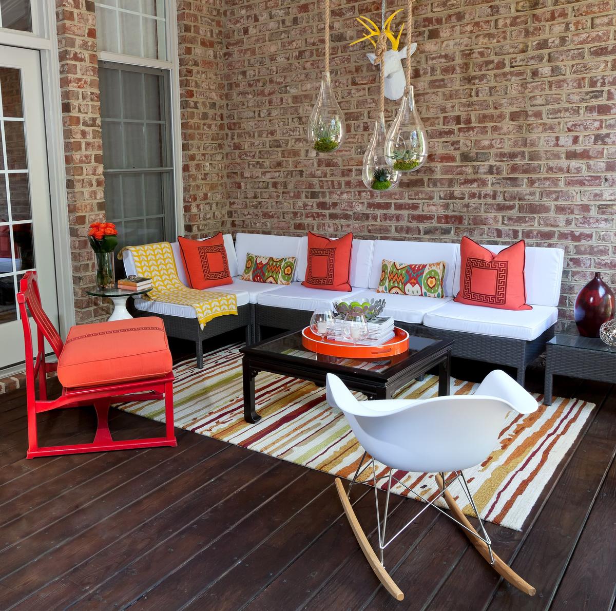 Rich hues of red, orange, green and yellow where juxtaposed with crisp white to create a fun, vibrant outdoor space.