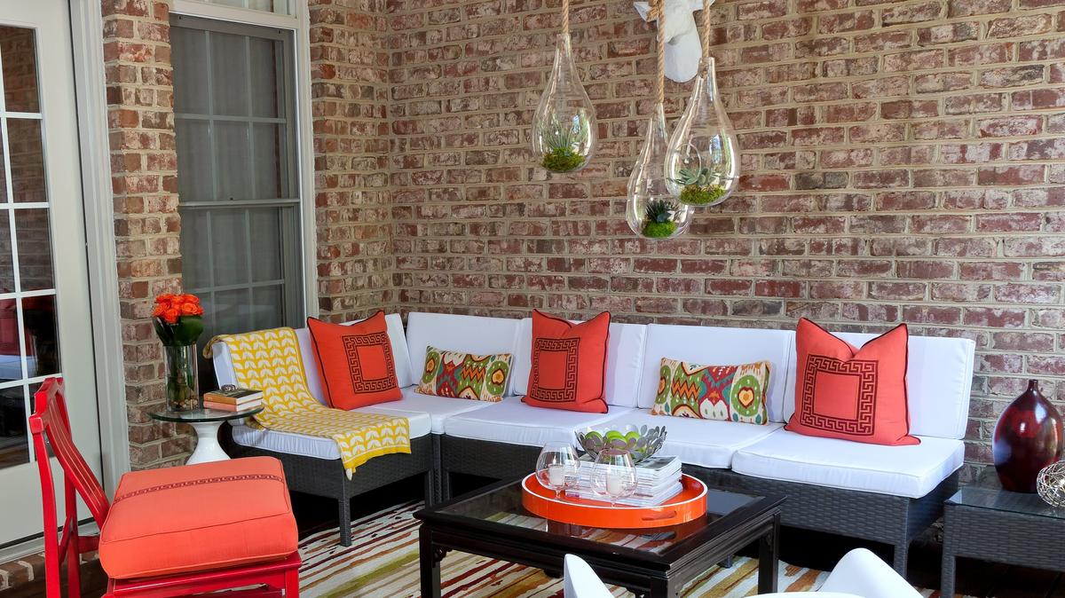 Rich hues of red, orange, green and yellow where juxtaposed with crisp white to create a fun, vibrant outdoor space.