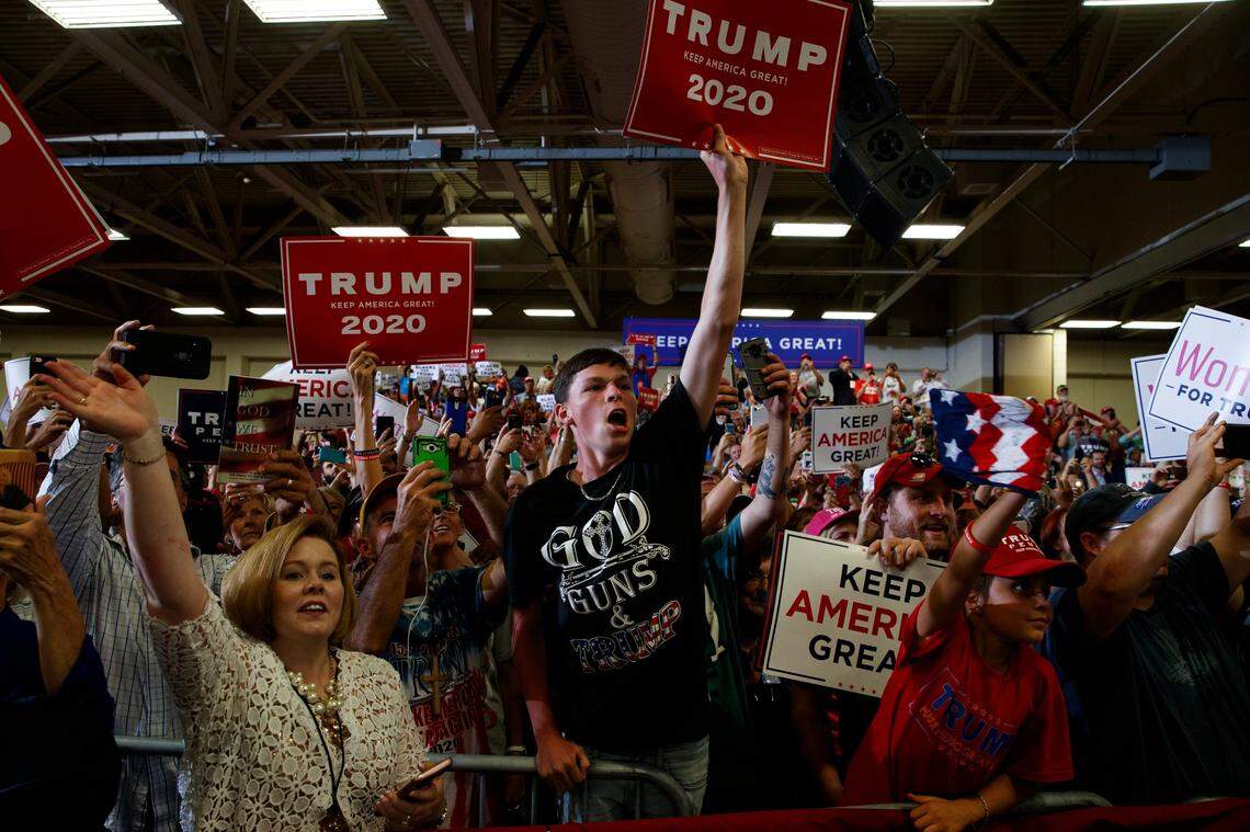 Supporters of President Donald Trump cheer as he arrives on stage at the Crown Expo for a campaign rally, Monday, Sept. 9, 2019, in Fayetteville, N.C.