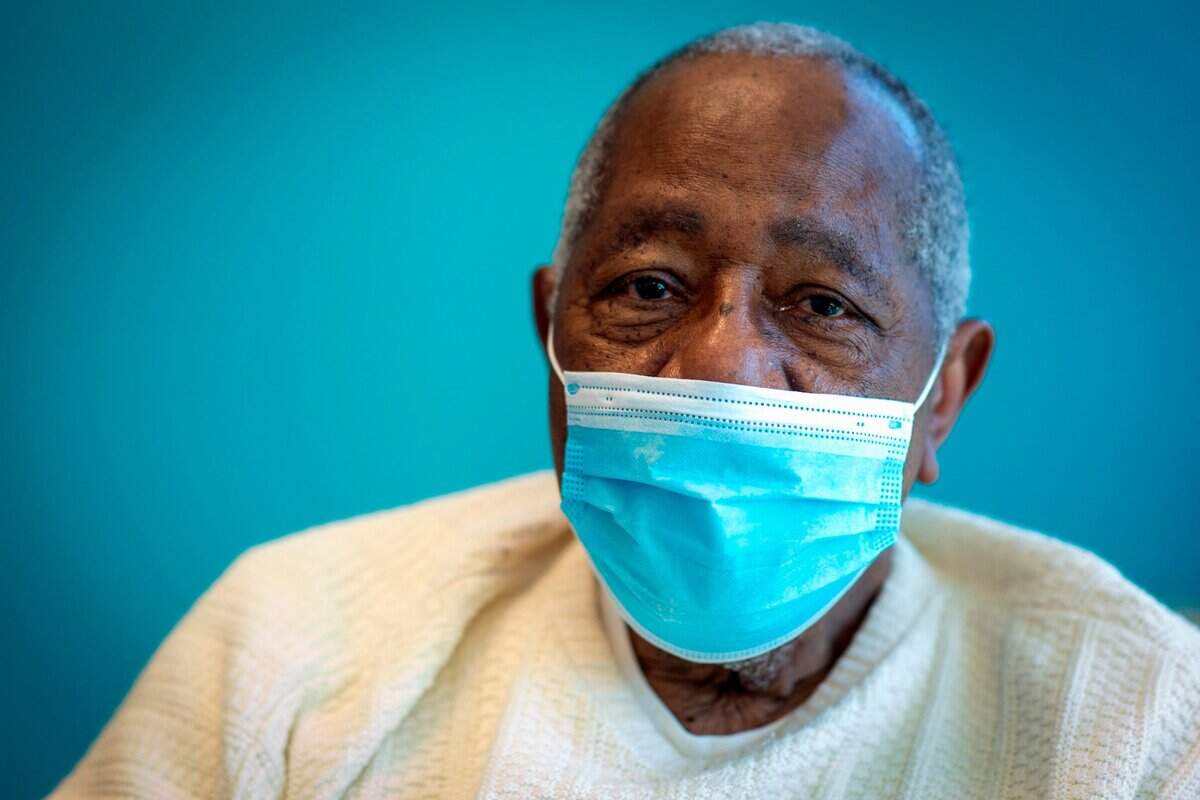Baseball Hall of Famer Hank Aaron sits for a portrait after receiving his COVID-19 vaccination at the Morehouse School of Medicine in Atlanta, in this Tuesday, Jan. 5, 2021, file photo. Hank Aaron, who endured racist threats with stoic dignity during his pursuit of Babe Ruth but went on to break the career home run record in the pre-steroids era, died early Friday, Jan. 22, 2021. He was 86. The Atlanta Braves said Aaron died peacefully in his sleep. No cause of death was given.
