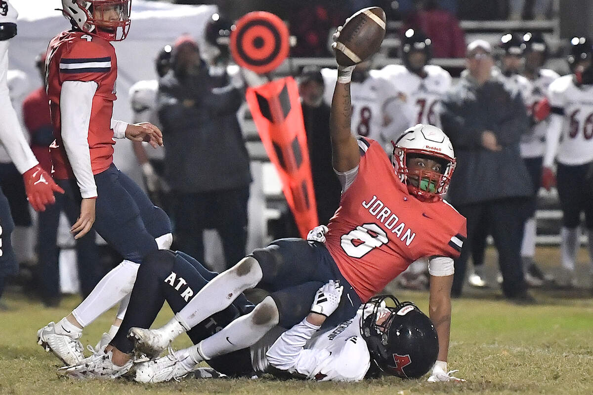 Jordan linebacker Kamari Blue (8) reacts after making the interception against Apex Friendship’s Andrew Elko (6) during the second half. The Apex Friendship Patriots and the Durham Jordan Falcons met in the second round of the NCHSAA 4A playoffs in Durham, N.C. on November 22, 2024.