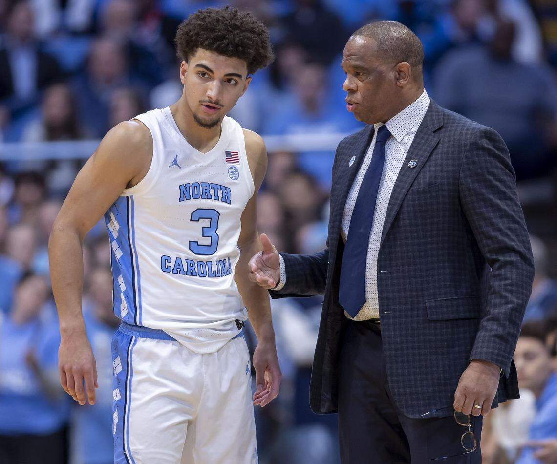 North Carolina coach Hubert Davis talks with guard Derek Dixon (3) in the first half against Notre Dame on Wednesday, January 21, 2026 at the Smith Center in Chapel Hill, N.C. 