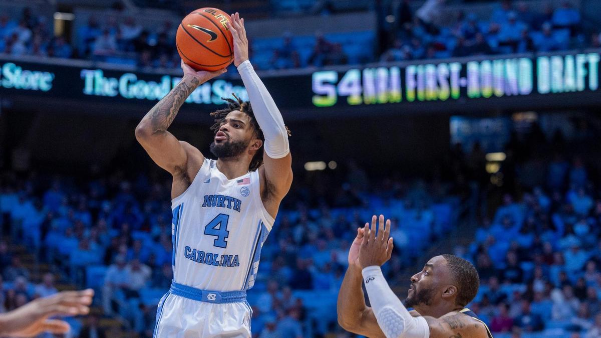 North Carolina’s R.J. Davis (4) puts up a shot over Charleston Southern’s R.J. Johnson (22) in the first half on Friday, December 29, 2023 at the Smith Center in Chapel Hill, N.C.