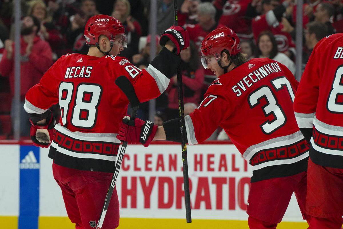 Carolina Hurricanes right wing Andrei Svechnikov (37) is congratulated by center Martin Necas (88) after his goal against the Philadelphia Flyers during the first period at PNC Arena.