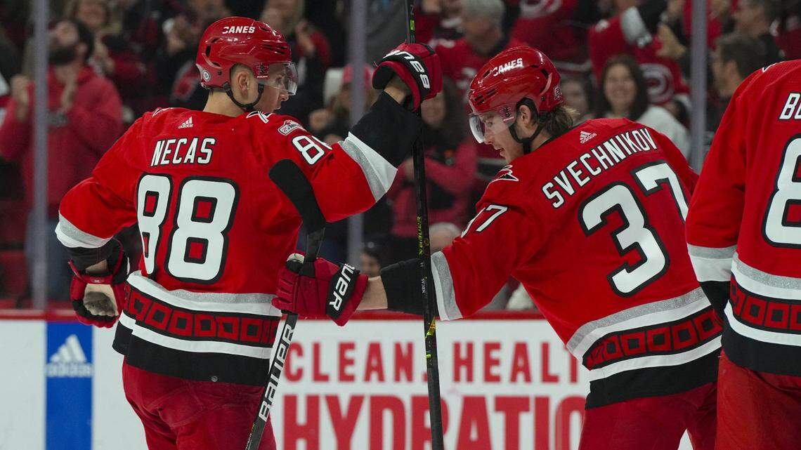 Carolina Hurricanes right wing Andrei Svechnikov (37) is congratulated by center Martin Necas (88) after his goal against the Philadelphia Flyers during the first period at PNC Arena.