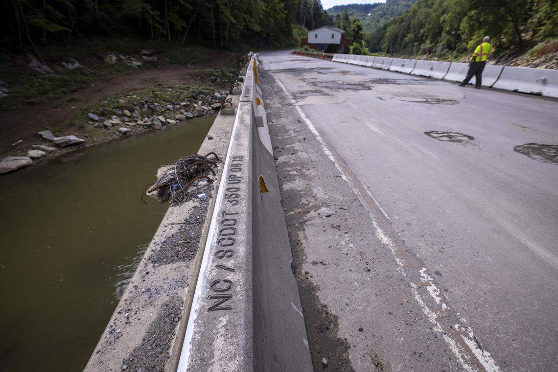 A bridge that carries U.S. 19W over the Cane River in Yancey County in August. The bridge has been repaired enough to reopen to traffic after it was damaged by flooding from the remnants of Hurricane Helene in 2024, but it will need to be replaced.