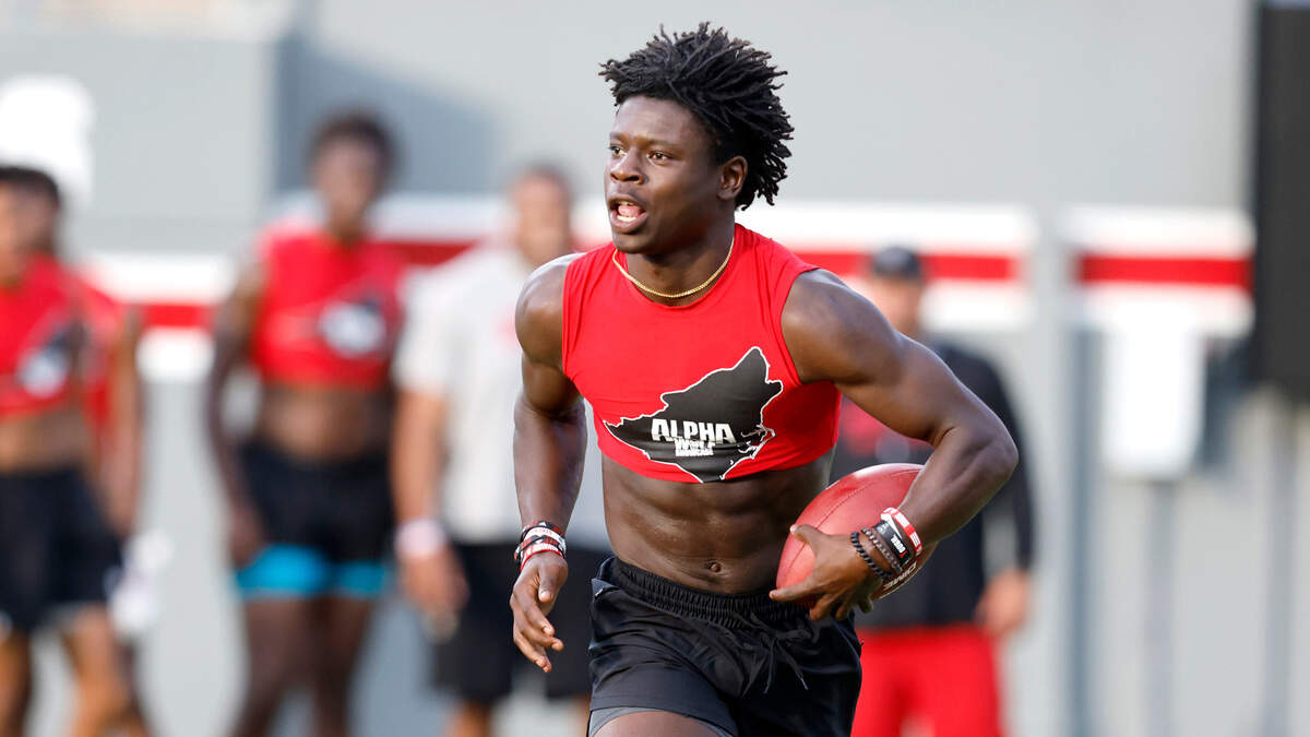 N.C. State commit Zach Myers runs drills during the Alpha Wolf showcase at Carter-Finley Stadium in Raleigh, N.C., Friday, July 29, 2022.