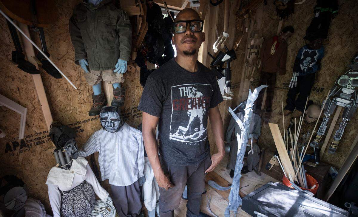 Jeghetto, whose real name is Tarish Pipkins, stands for a portrait in his studio outside of his home in Chapel Hill on Wednesday, May 30, 2018. Jeghetto is a puppeteer and an artist who has work featured in a music video for rapper Missy Elliot and an Amazon Echo commercial. He has also worked with the Paperhand Puppet Intervention. His new show, "Just Another Lynching," will be performed at The Arts Center in Carrboro, NC on June 8th and 9th.  